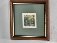 Full view of framed lithograph with mat and frame