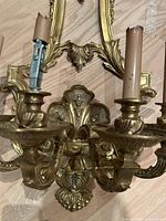 Close-up of lower section with arms and fleur-de-lis detailing