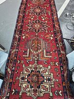 Full view of Persian red geometric runner rug