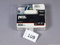 Front view of sealed Petzl Tikka headlamp package showing product and lot number