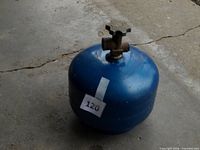 Blue propane cylinder showing overall shape and valve