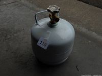 full view of white propane cylinder with valve and handle