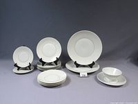 Overall view showing dinner plates, side plates, footed bowl and underplate