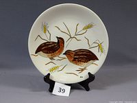 Front view of Gien Les Oiseaux plate showing hand-painted corn crakes and BB signature