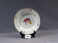 Front view of the Meissen Carl Teichert rimmed soup plate bowl showing floral pattern, molded rim and gilt edge