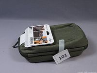 Closed tech pouch with retail hang tag attached