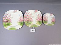 Three Blossom Time plates large, medium, small