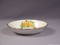 Side view of scalloped oval serving bowl