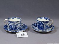 Two Mikado teacups on saucers showing pattern and form