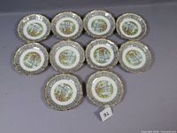 Group shot of all ten Royal Albert Silver Birch saucers displayed face up