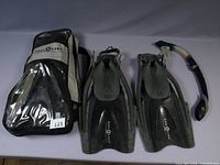 Pair of Aqua Lung fins, snorkel and branded carrying bag displayed
