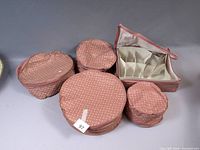 Group view of all five pink polka dot fabric storage cases