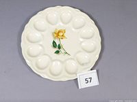 Top view of Georgian China Yellow Rose deviled egg plate with 12 wells