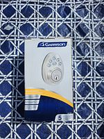 Front of Garrison electronic keypad deadbolt retail box