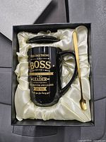 Gift set contents: mug, lid and spoon in satin-lined box