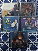 All five CDs laid out showing front artwork