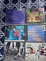 Back covers of all six CDs arranged in grid