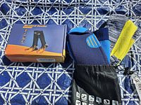 Heated socks box next to waterproof socks bag and partially visible socks