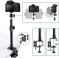 Stock image illustrating assembled desk clamp camera stand with DSLR attached and dimension callouts