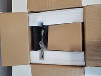 Box opened showing foam inserts and components