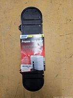 Actual replacement lid in factory wrap showing Camco branding and hardware pack