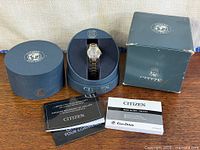 Group shot showing watch, inner box, outer box and manuals