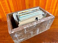 wooden box filled with postcards