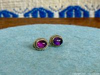 Front view of both amethyst stud earrings