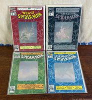 Group shot of four bagged hologram-cover Spider-Man 30th Anniversary comics