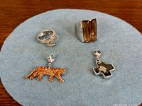 All four Swarovski items on felt background
