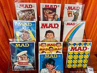 Front view showing all 12 bagged magazines on rack