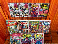 Rack holding twelve bagged #1 issues from various X-Men titles