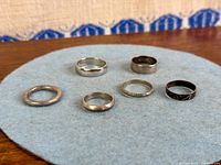all six sterling silver band rings on felt