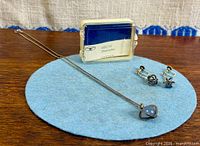 Full view of necklace, earrings, and chalcedony reference box