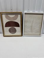 Both framed art prints side by side