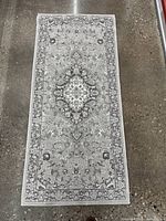 Full view of grey patterned runner rug
