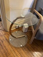 full view of side table showing top, base and curved support