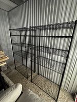 front view of both shelving units against corrugated wall