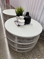 Overhead view of one table with decor items on top, second table partially visible