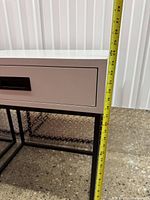 close view with tape measure indicating height