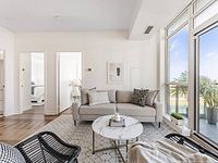 Front view of grey sofa with pillows