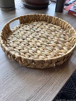 top view of round woven wicker tray showing overall shape and texture