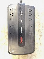 Top view showing APC Back-UPS 750 label and eight outlets