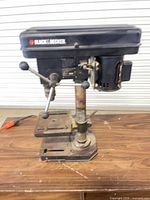 Full view of Black & Decker benchtop drill press on table