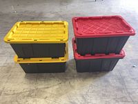 Four stacked HDX totes, two yellow-lidded, two red-lidded