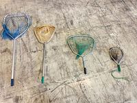 All four landing nets lined up showing relative sizes and mesh colors