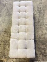 Top view showing tufted fabric surface and color