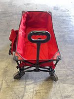 Front angled view showing wagon structure, handle, front wheels