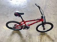 Full view of red 20-inch child bicycle