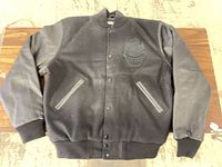 Full front view of black Varsity Base varsity jacket